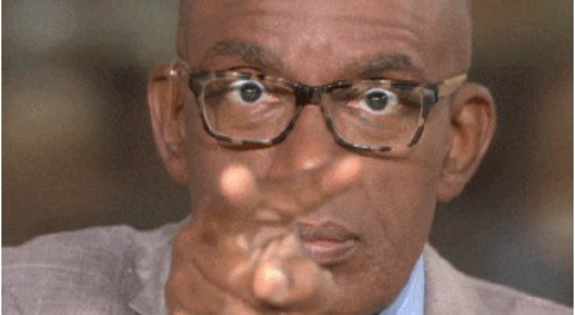 Man wearing glasses pointing directly at the camera