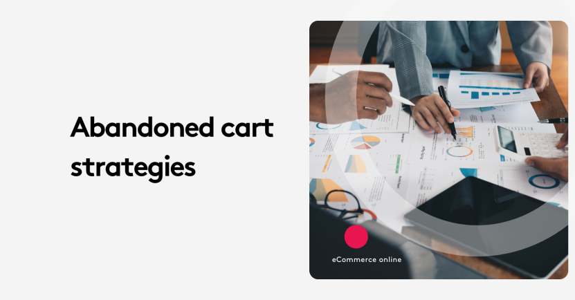 Team discussing abandoned cart strategies with charts and graphs on a table.