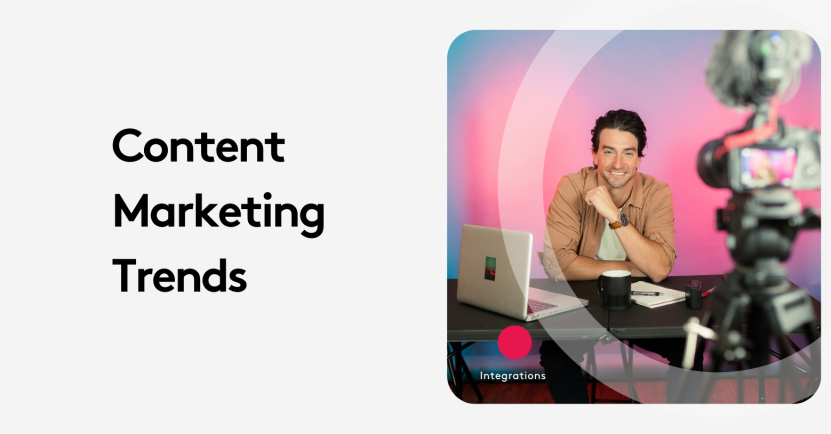 Man in front of camera discussing content marketing trends with laptop and coffee