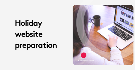 Person working on holiday website preparation on a laptop with coffee nearby.