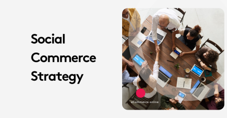 Team discussing social commerce strategy around a table with laptops and tablets.