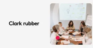 Team in a meeting room discussing ideas with presentation on screen