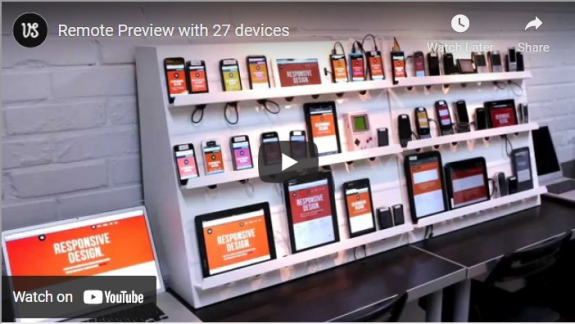 Multiple devices showcasing responsive design testing on shelves.