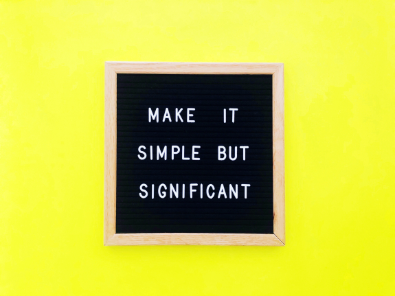 Letter board with quote 'Make it simple but significant' on yellow background.