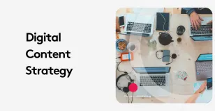 Overhead view of a digital content strategy meeting with laptops and devices on a wooden table.