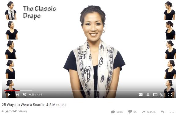 Woman demonstrating the classic drape scarf style with a printed scarf
