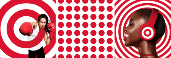 Two women with boxing gloves and headphones against red target patterns.