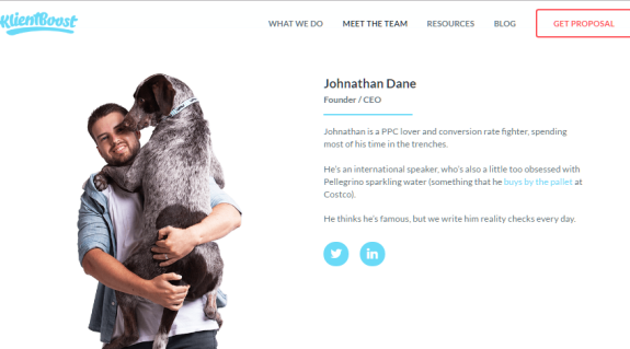 Man holding large dog and smiling on a profile page