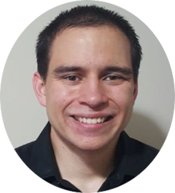 Smiling man in a black shirt against a plain background.