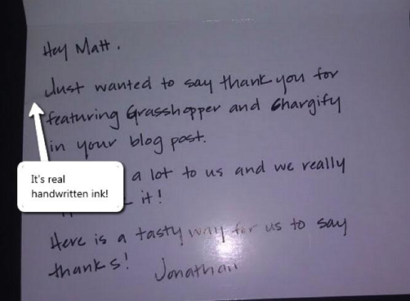 Handwritten thank you note on dark background with an arrow pointing to text.