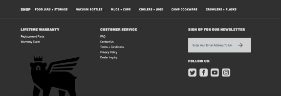 Website footer with navigation links and social media icons on dark background