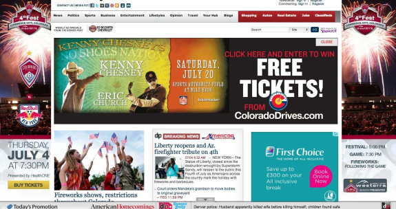 Promotional webpage featuring Kenny Chesney concert, 4th of July fireworks, and ticket offers.
