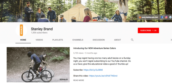 Stanley Brand YouTube channel banner with camping setup in a forest