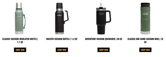 Four Stanley vacuum bottles and mugs in various sizes and colors on display.