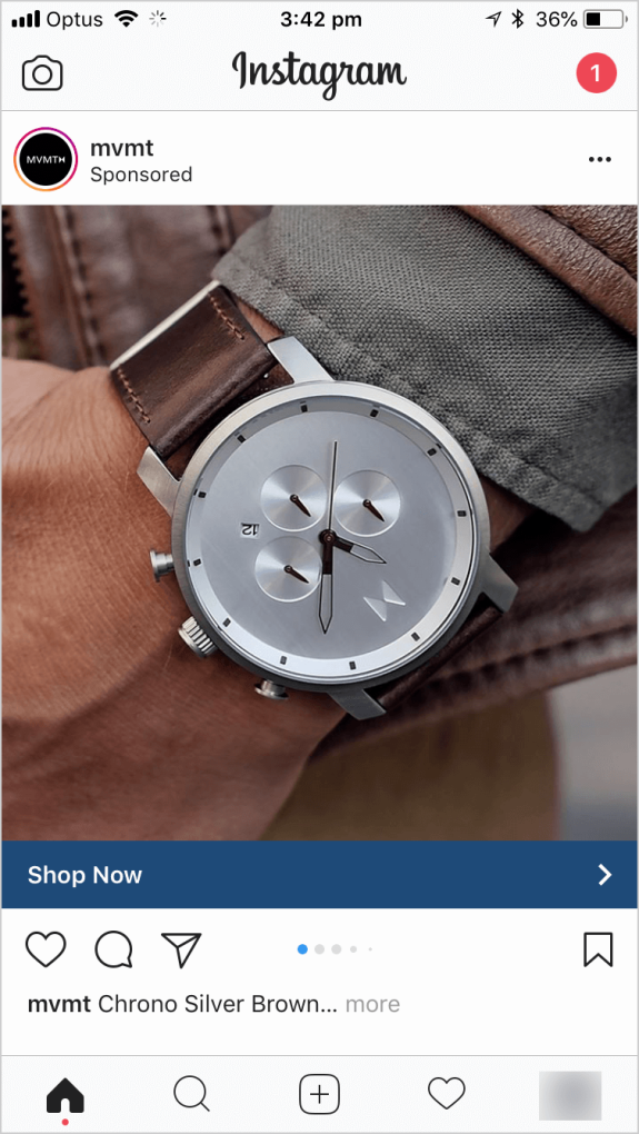 Silver watch with brown leather strap on wrist close-up