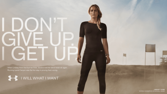 Athlete in Under Armour gear with motivational quote 'I don't give up. I get up.'