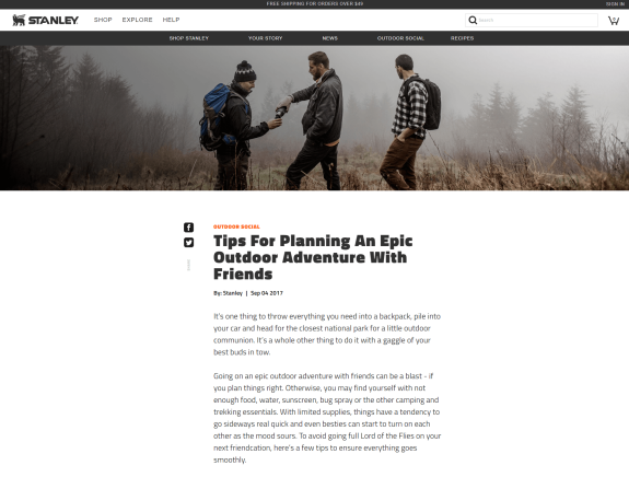 Three friends hiking with backpacks in a foggy forest.