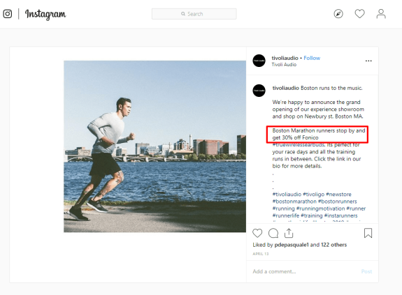 Man running along river with Boston skyline in background