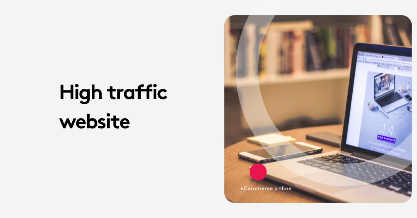 Laptop and smartphone on desk displaying high traffic website.