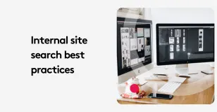 Dual monitors displaying internal site search best practices on a desk.