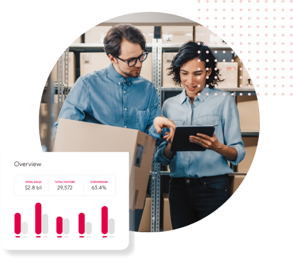Warehouse team discussing business data on a tablet with charts.