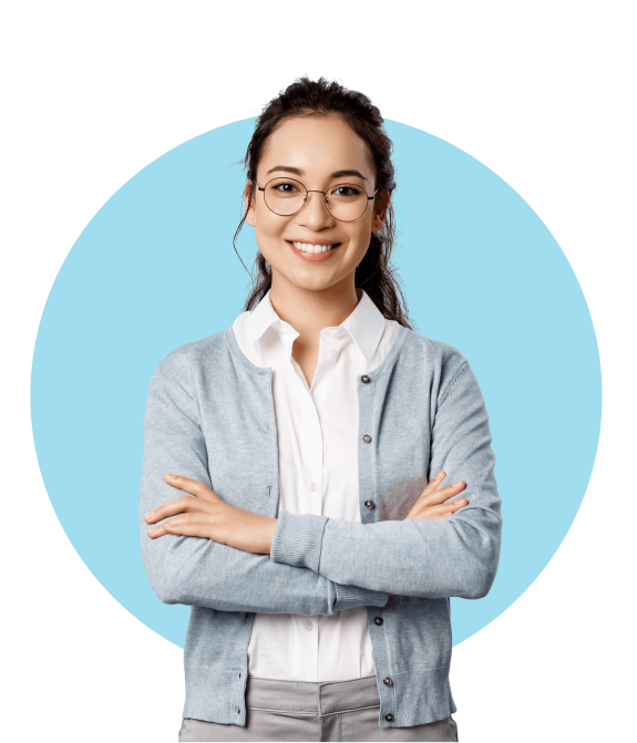 Woman in glasses smiling with arms crossed on blue background.