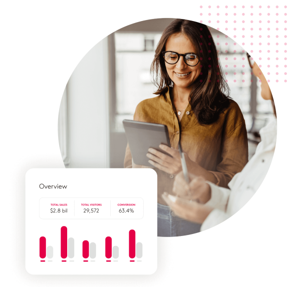 Businesswoman reviewing sales data on tablet with charts and graphs.